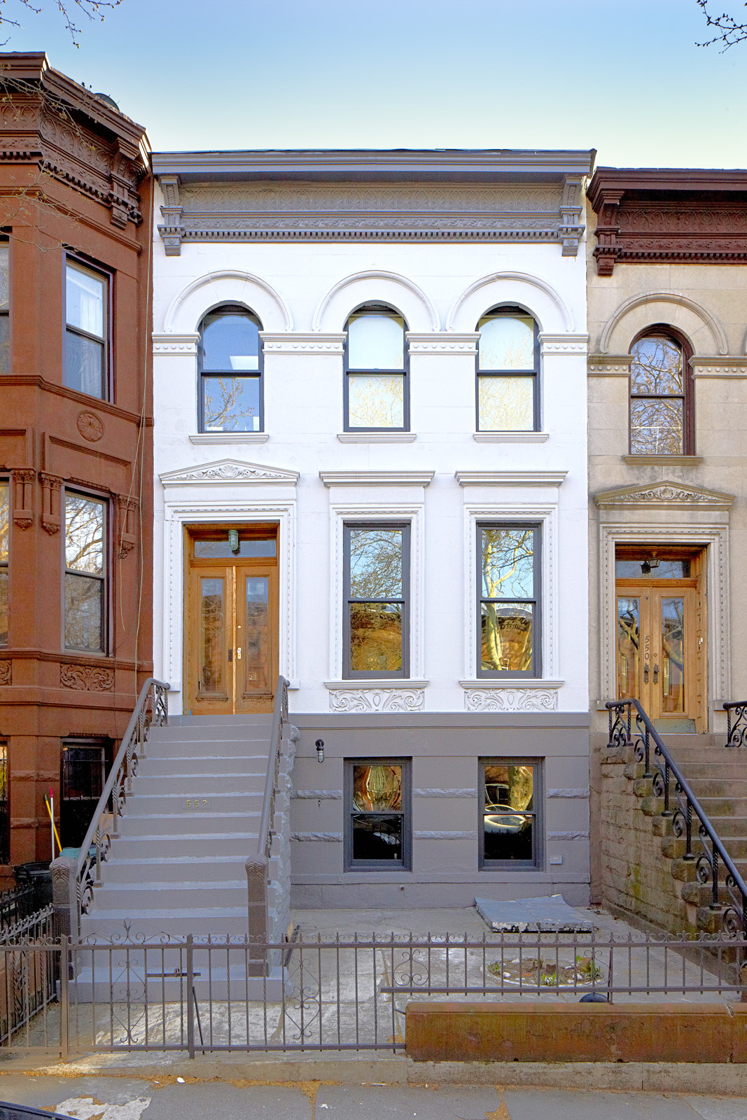 The rowhouse facade was restored its original color and finish.