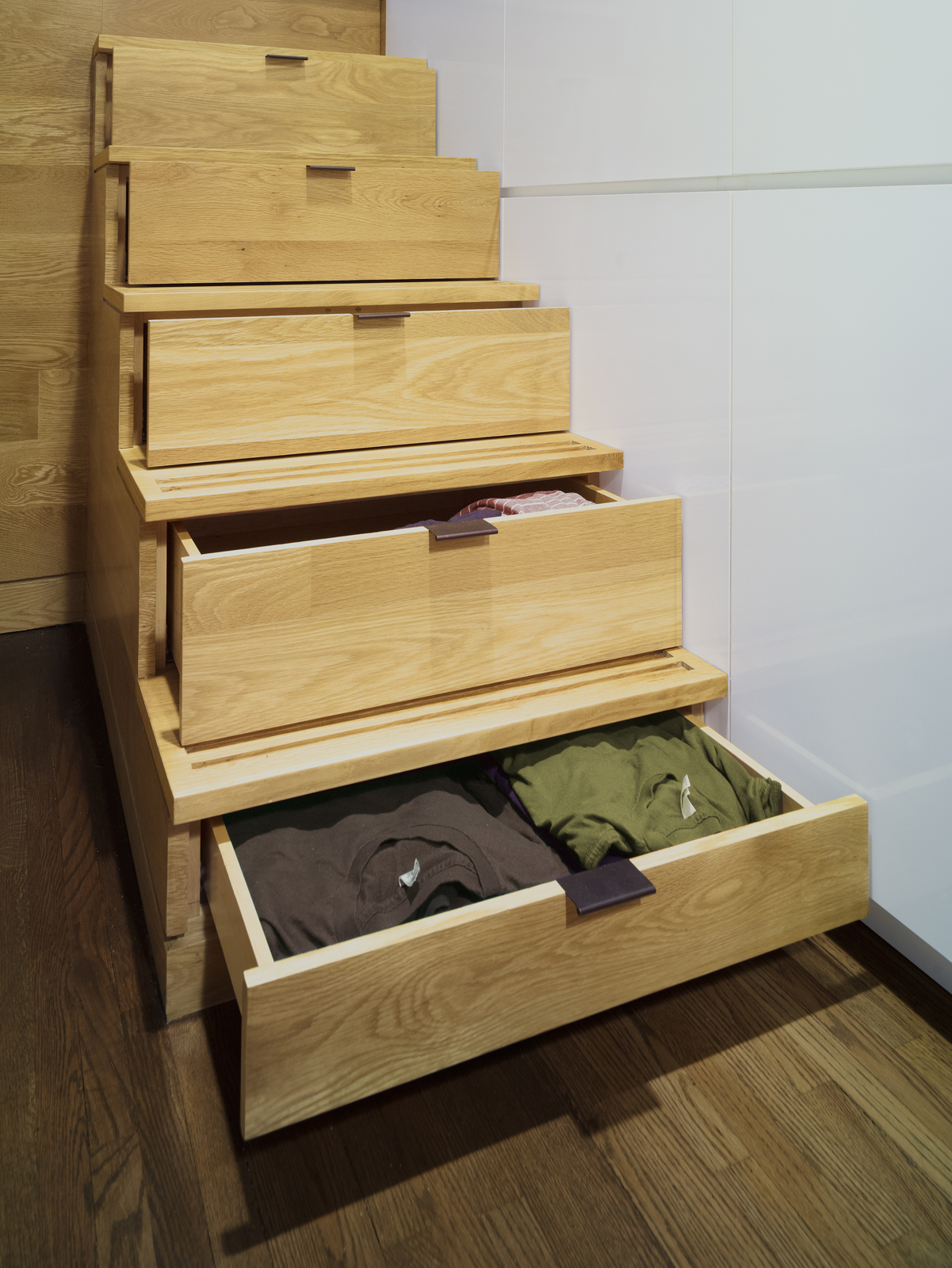 Stair risers leading up to the sleeping loft pull open to reveal hidden drawers.