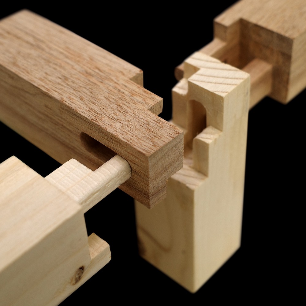 Wood joinery illustrating a non-destructive architectural connection that can be disassembled after the life of the building
