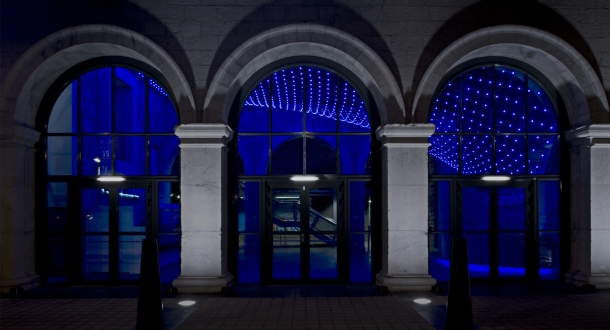 The lighting installation swoops down to the concierge customer service desk